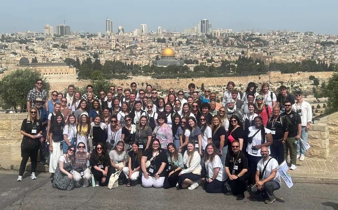 Campus Choir in front of the Walled City of Jerusalem and the Dome of the Rock.